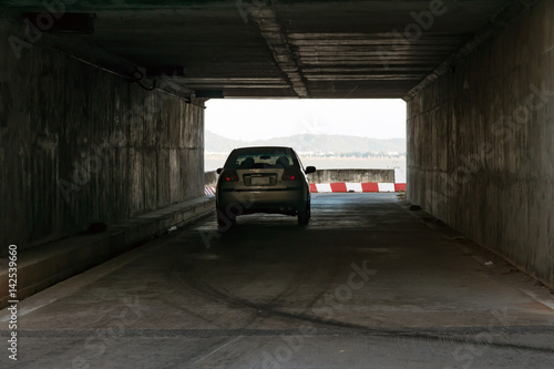 The tunnel passes under the bridge
