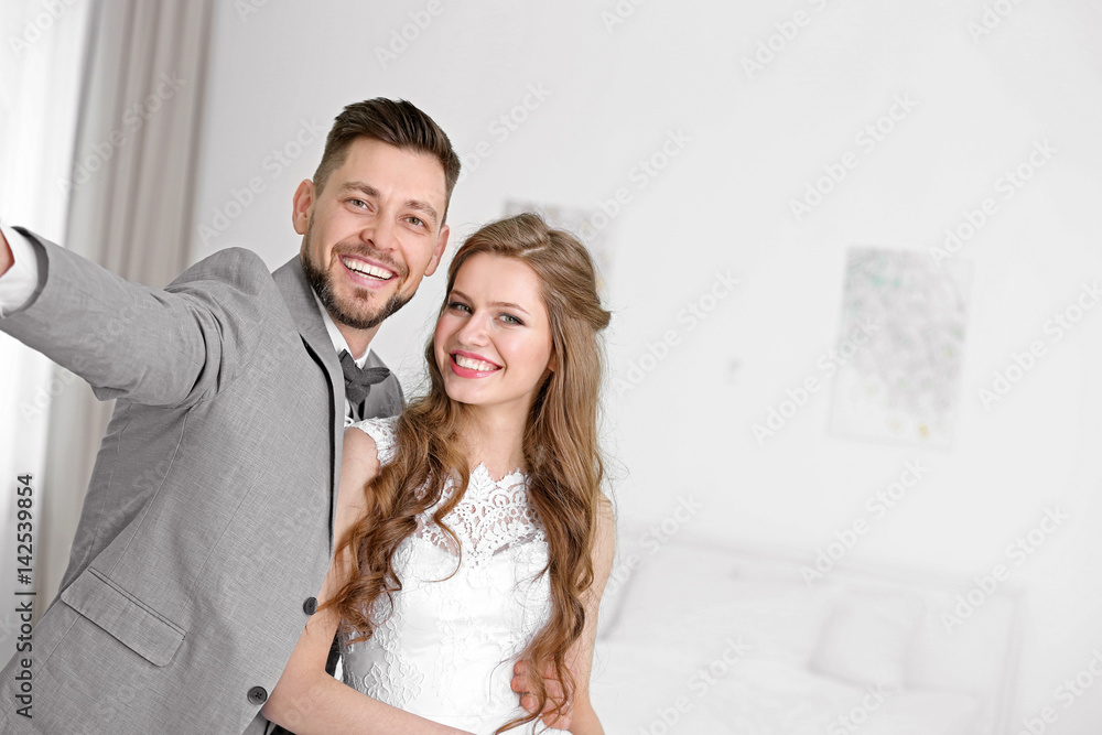Happy wedding couple taking selfie at home Happy wedding couple taking selfie at home
