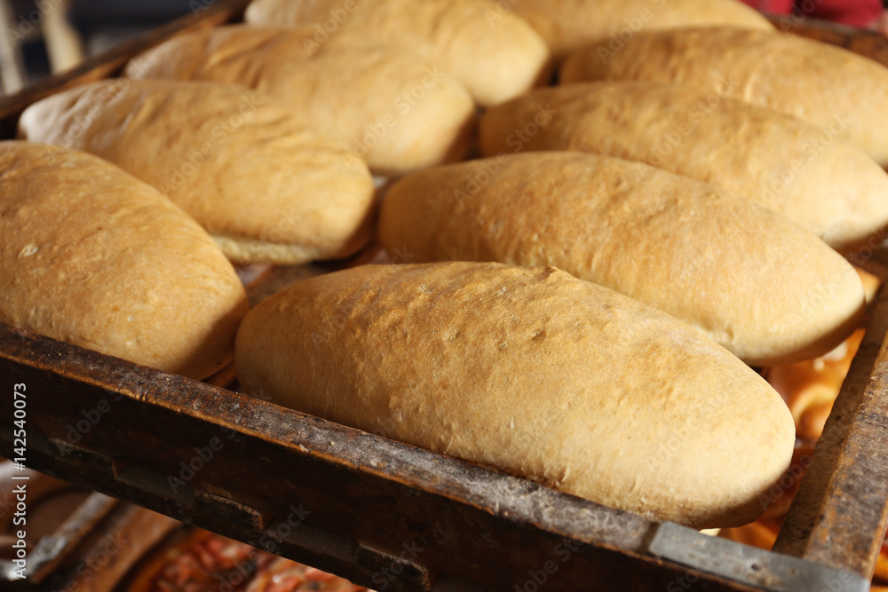 Wooden pallet with bread, closeup