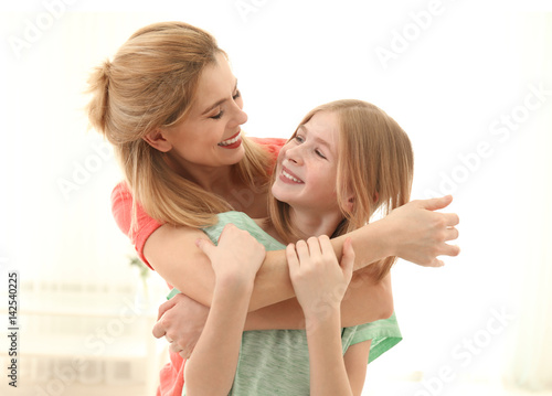 Happy mother and daughter o...