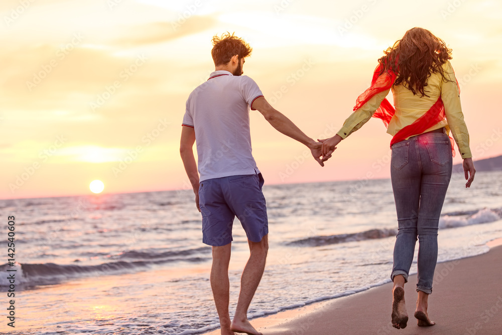 happy young romantic couple in love have fun on beautiful beach at beautiful summer day happy young romantic couple in love have fun on beautiful beach at beautiful summer day