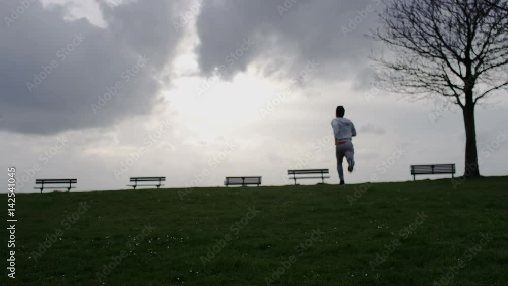 4K Healthy male runs into the distance, in slow motion