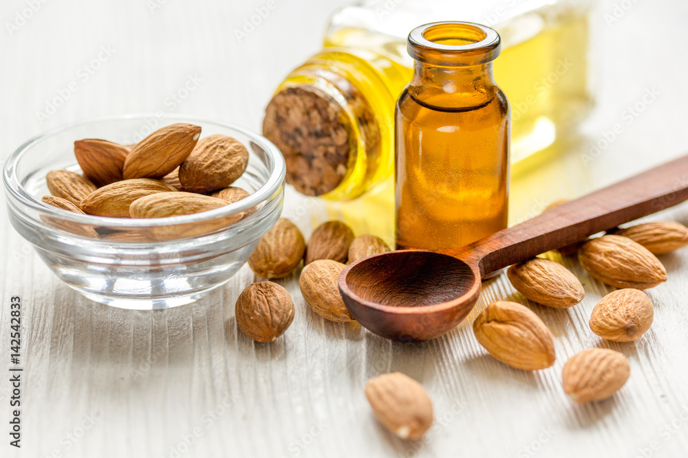 spa with almond oil in organic cosmetic set on white background spa with almond oil in organic cosmetic set on white background