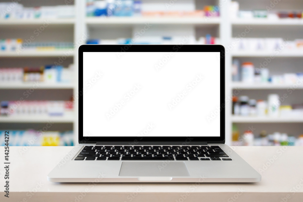 pharmacy store with laptop computer on medical counter pharmacy store with laptop computer on medical counter