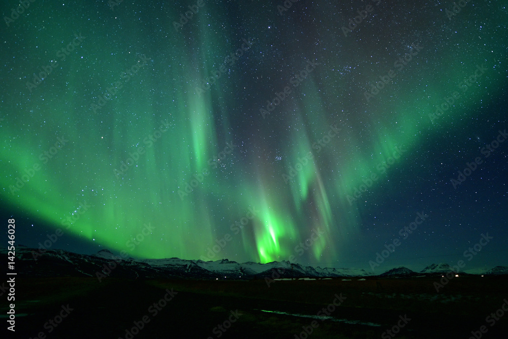 Spectacular auroral display at night over mountian ,spectacular auroral and star at night ,Iceland