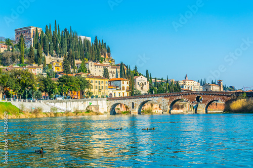 Obraz na plátně View of the ponte pietra bridge over river adige and the castle san pietro on th