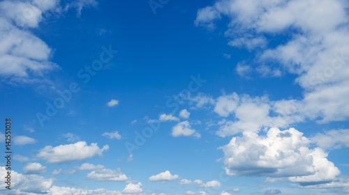 Heaven, clouds flying against blue sky.