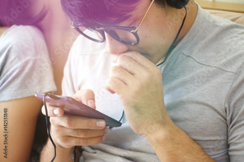 Man is addicted to playing game in mobile phone