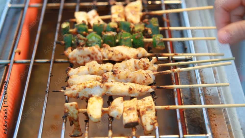 Sichuan pepper barbecue on grill grate at market street food. Sichuan pepper barbecue on grill grate at market street food.