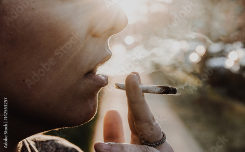 Woman Smoking A Marijuana Joint