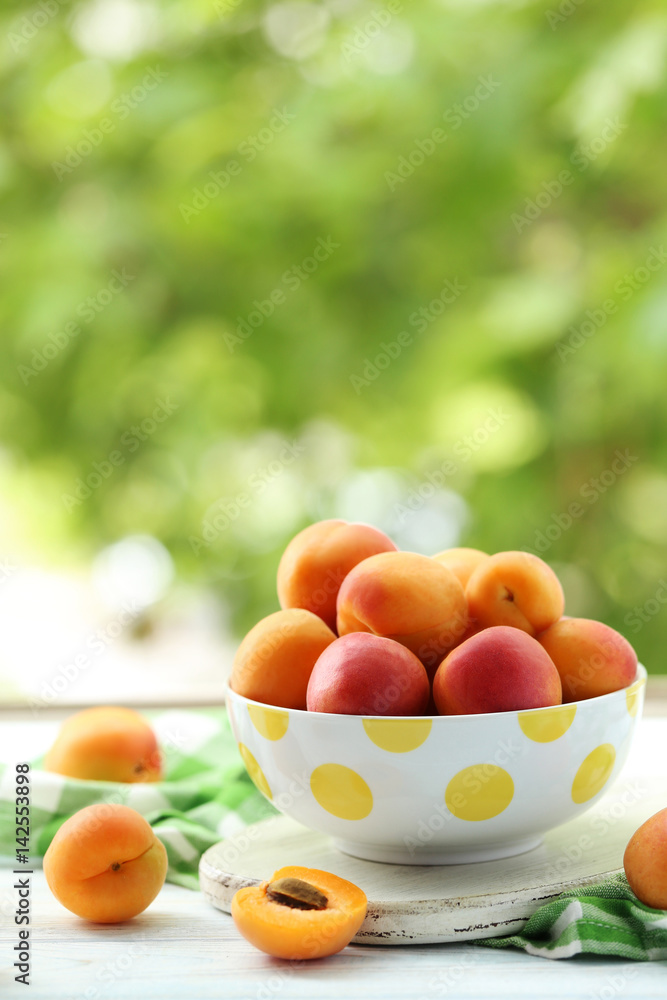 Ripe apricots fruit on white wooden table Ripe apricots fruit on white wooden table