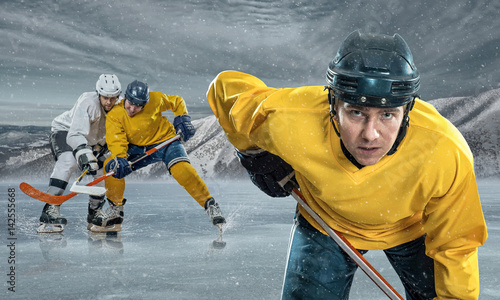 Wallpaper Mural Ice hockey player on the ice in mountains Torontodigital.ca