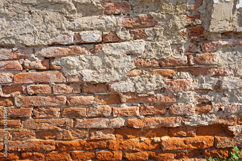 Old ruined brick wall of a building