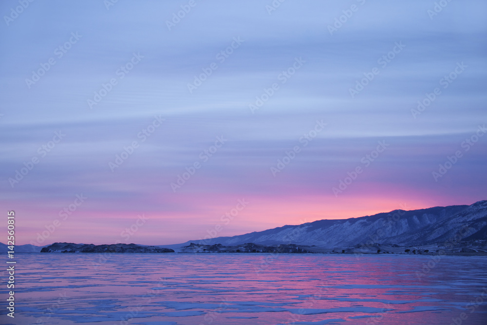 Lake Baikal, winter. Cape Uyuga sunset landscape.