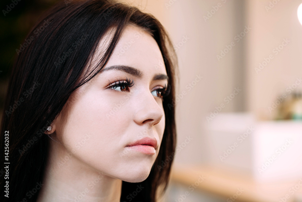 Profile of pretty brunette girl with long eyelashes Profile of pretty brunette girl with long eyelashes