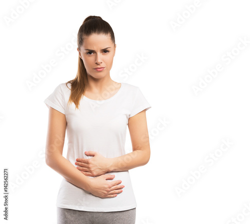 Woman having abdominal pain isolated on white © Tijana