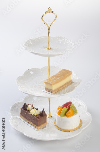 tray or three tier serving tray with dessert. photo