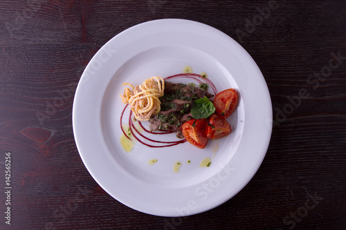 sliced beef served with home made pasta and tomato