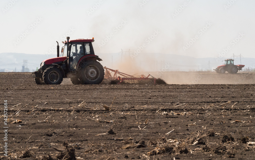 Fototapeta premium Tractor preparing land