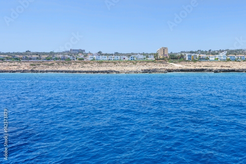 Fototapeta Naklejka Na Ścianę i Meble -  Sea view with immaculate water, beach and hotels, un buffer zone, famagusta, cyprus island