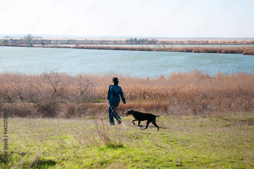 walking woman with dog
