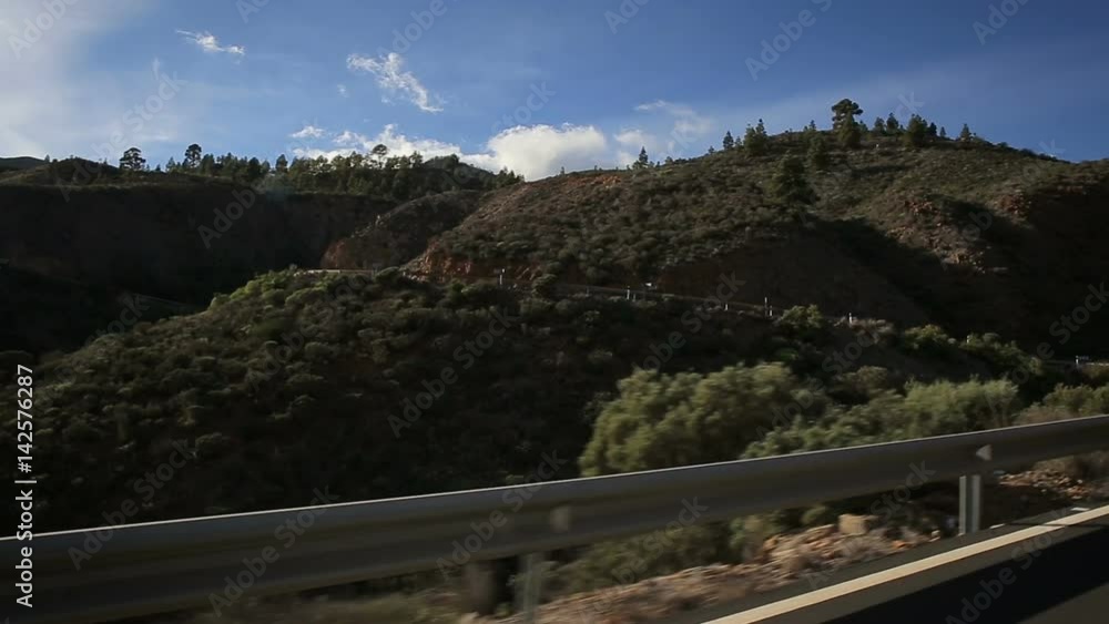 Driving a car on the mountain road Driving a car on the mountain road
