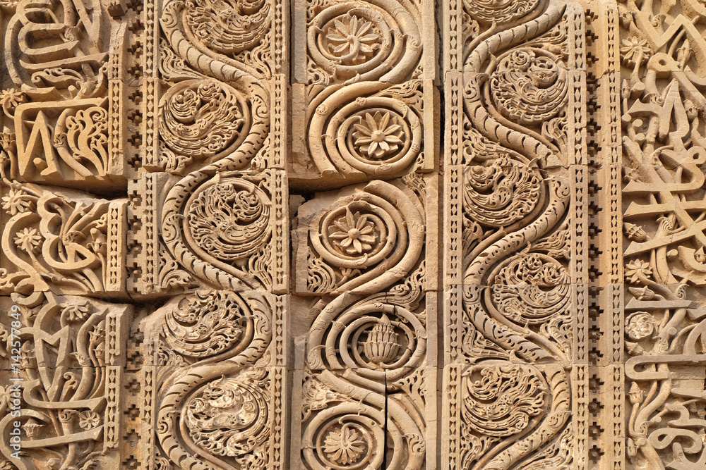 Stone carving on Qutab Minar, Delhi, India 