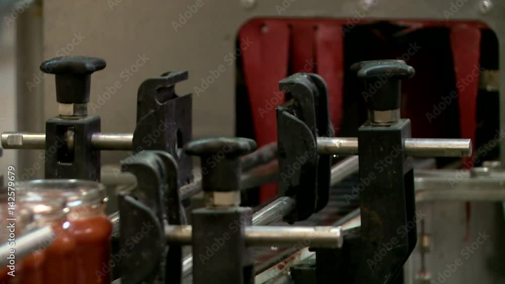 the conveyor at the factory for the production of tomato sauce ketchup adzhika mustard seasonings the conveyor at the factory for the production of tomato sauce ketchup adzhika mustard seasonings