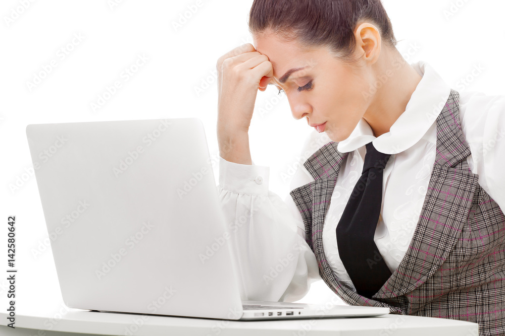 Tired overworked freelancer working with a laptop Tired overworked freelancer working with a laptop