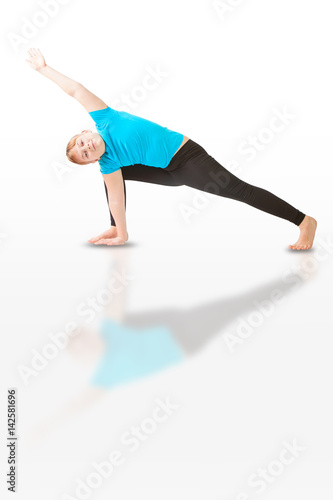 beautiful woman doing yoga on white background