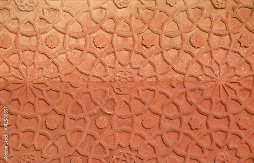 Stone pattern on a temple wall in Red Fort, Agra, UNESCO World heritage site, India  photo