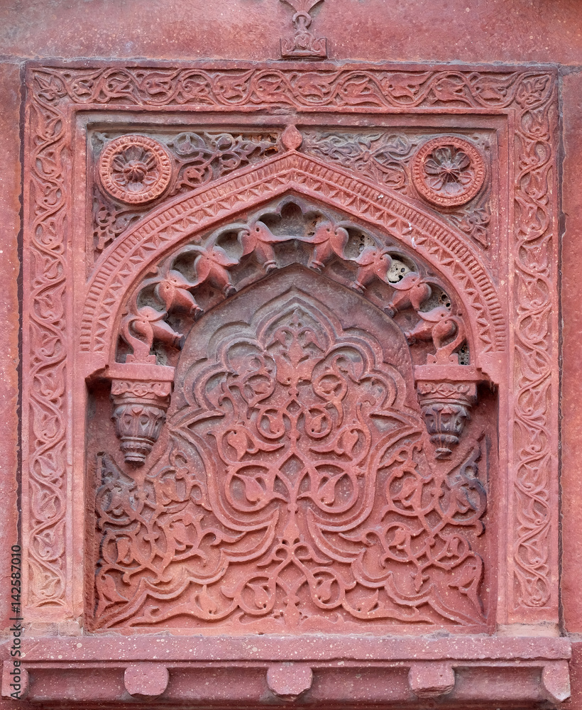 Stone pattern on a temple wall in Red Fort, Agra, UNESCO World heritage site, India