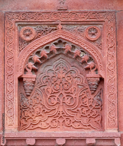Stone pattern on a temple wall in Red Fort, Agra, UNESCO World heritage site, India