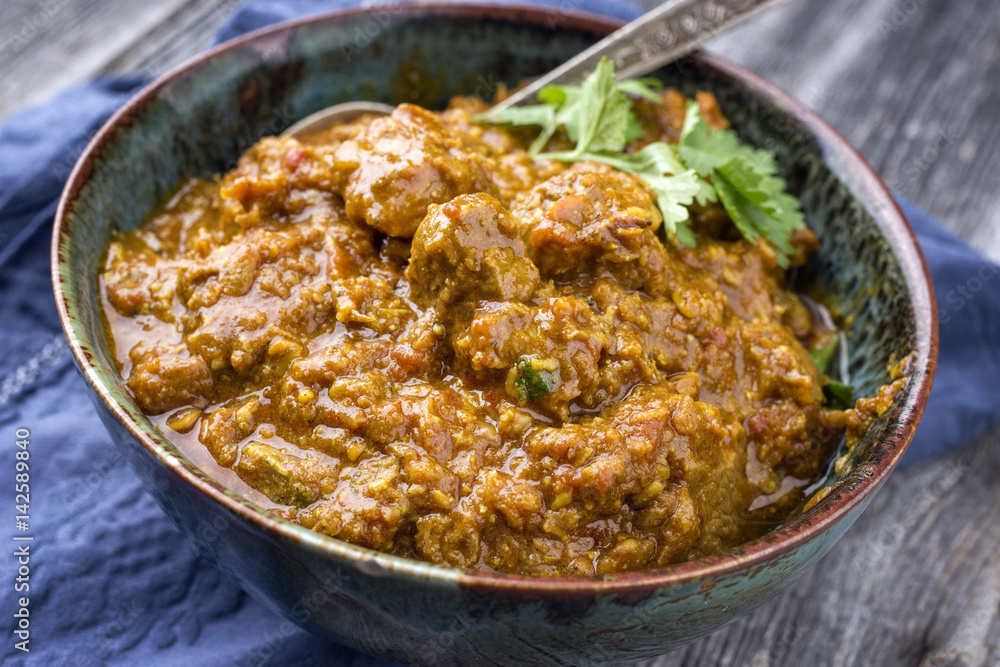 Traditional Indian Lamb Curry as close-up in a bowl
