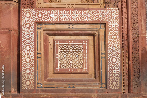 Beautiful stone carvings on the wall in Fatehpur Sikri complex  Uttar Pradesh  India .