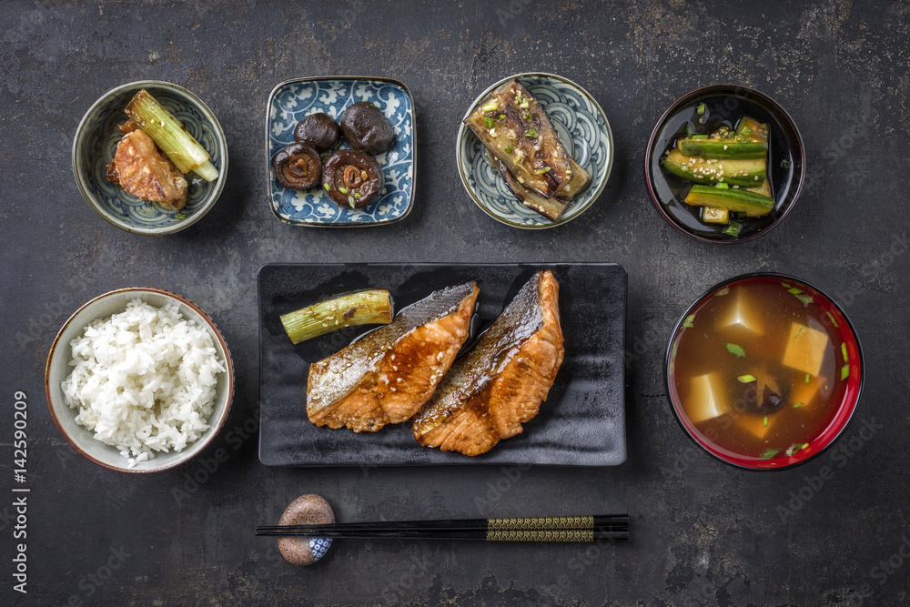 Traditional Japanese dish with Fish Teriyaki and Soup as close-up in bowls