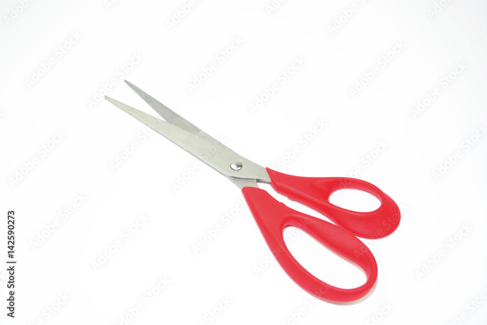 Red metal scissors on the white background Red metal scissors on the white background