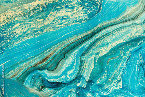 Blue marbling texture. Creative abstract background with handmade oil painted surface. Liquid paint.
