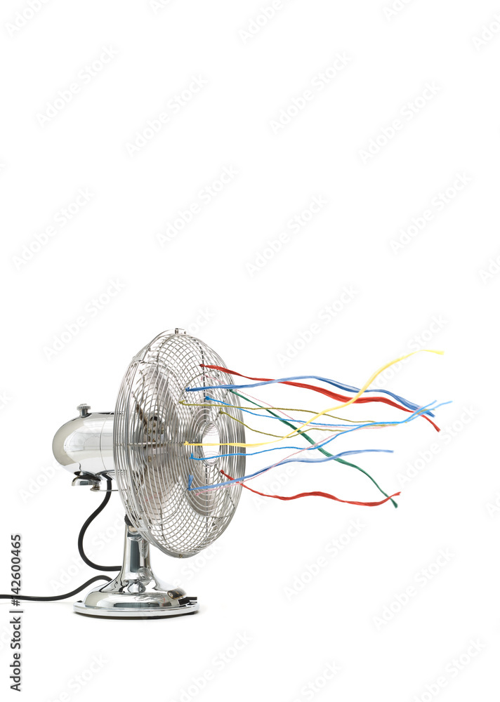 Fan with colored ribbons in front of white