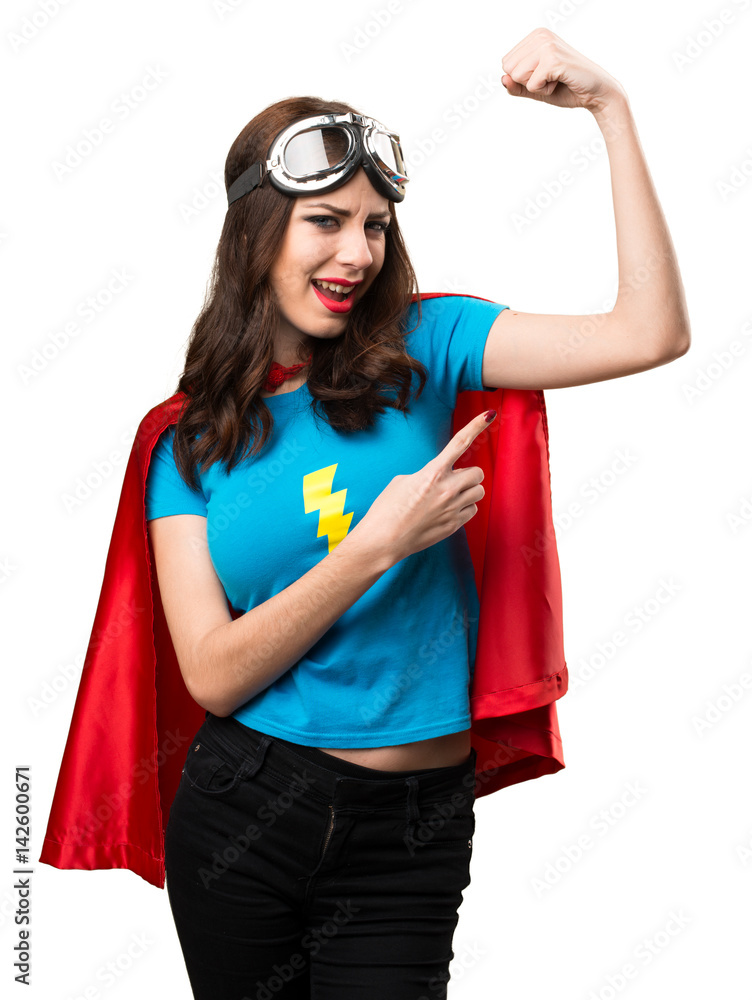 Pretty superhero girl making strong gesture Pretty superhero girl making strong gesture