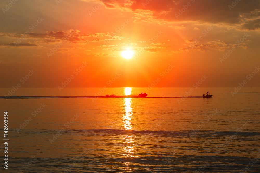 Sunrise and sea landscape, silhouette people activities at sea