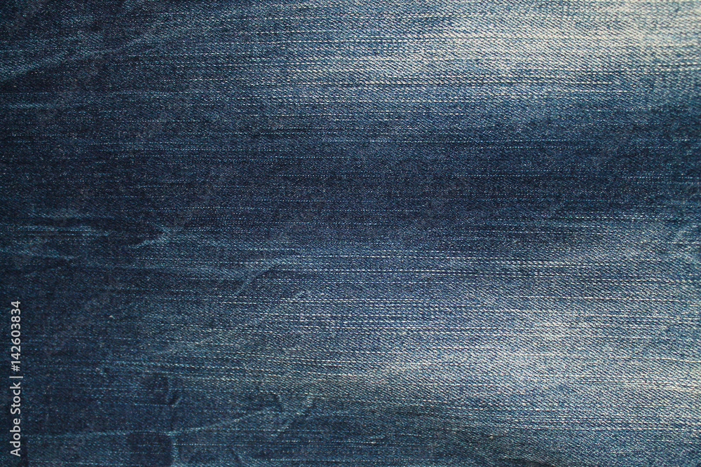 Foto de Blue washed denim jeans fabric texture, textile background