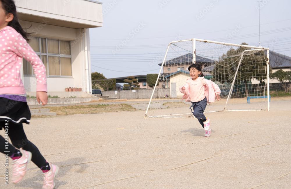 校庭で走る女の子 Stock Photo Adobe Stock
