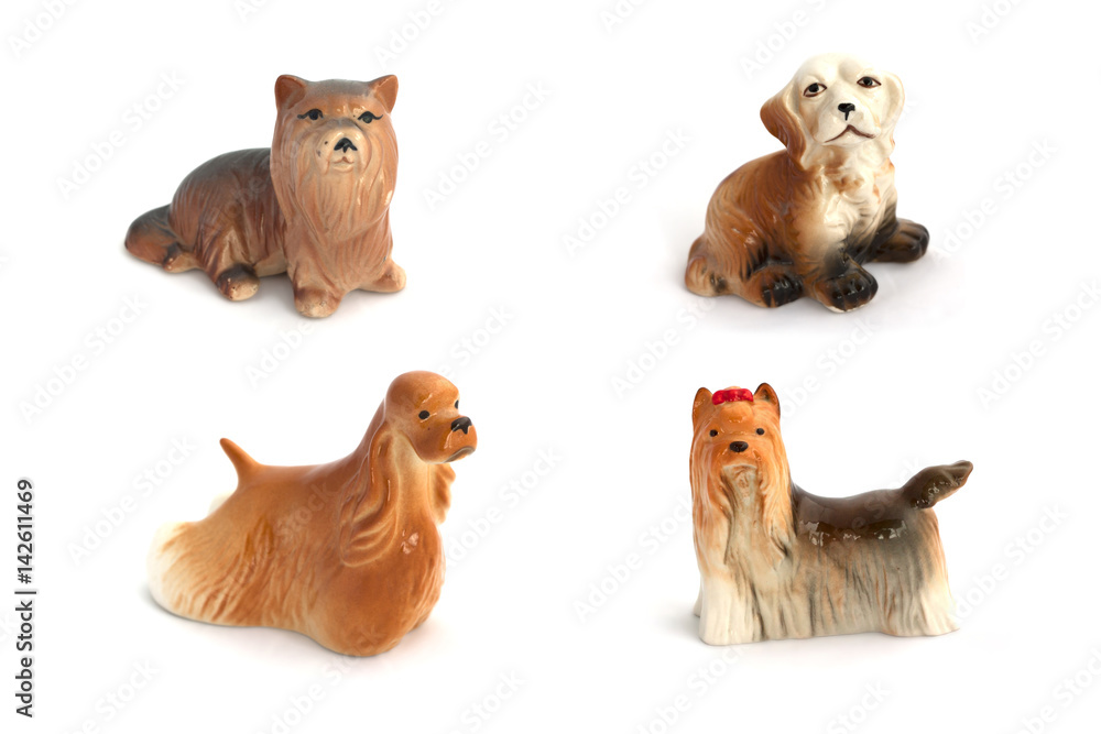 Collage of porcelain dogs isolated on white background