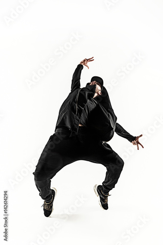 Tablou pe pânză The silhouette of one hip hop male break dancer dancing on white background