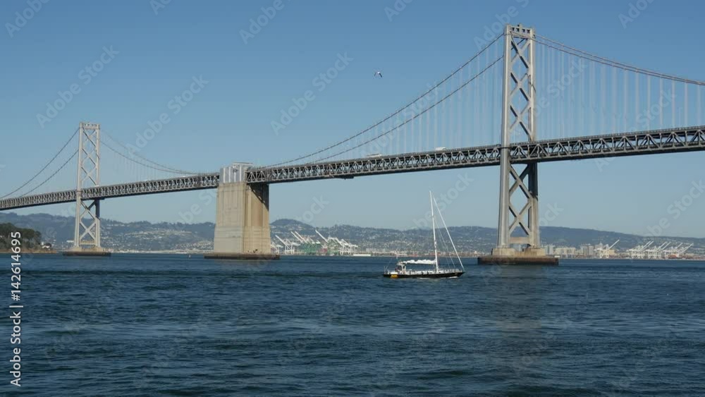Sailboat at the Oakland Bay Bridge in San Francisco Sailboat at the Oakland Bay Bridge in San Francisco