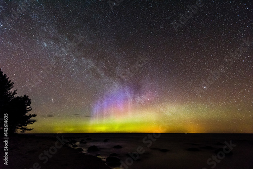 Intense northern lights (Aurora borealis) over Baltic sea © Martins Vanags