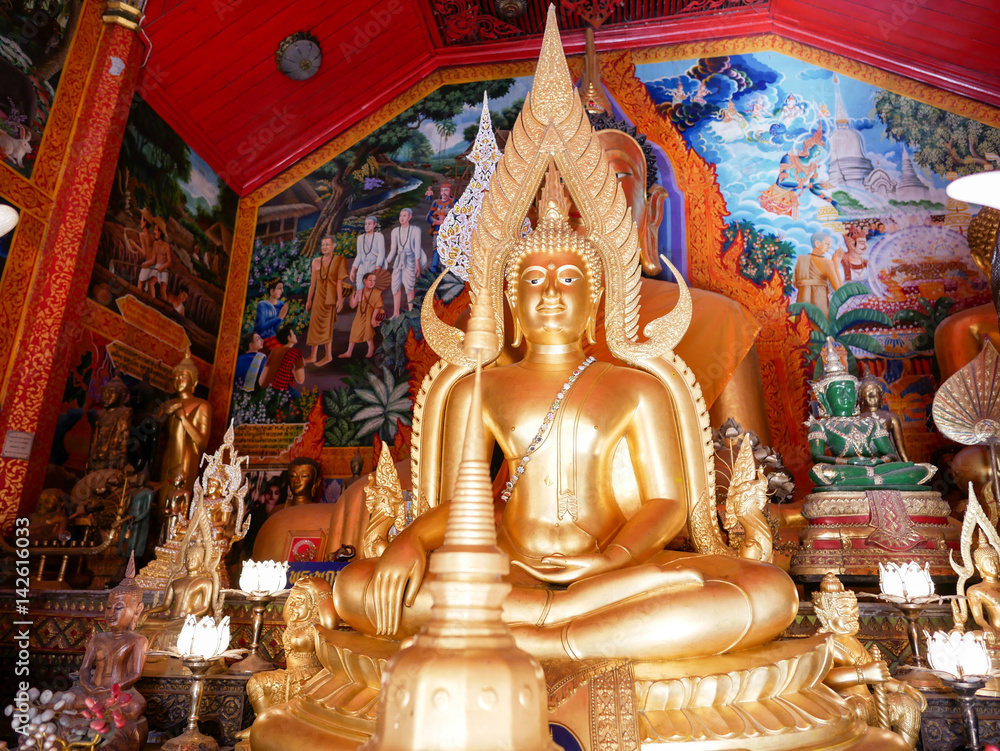 Buddha statues inside the Wat Phra That Doi Kham (Temple of the Golden Mountain) in Chiang Mai, Thailand