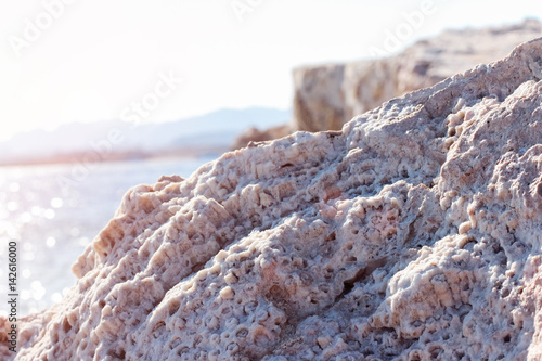 Schilderij op canvas Rock on the shore of the Red Sea. Sunset