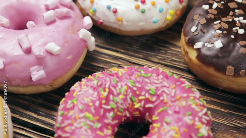donuts with different fillings on the table. dolly video donuts with different fillings on the table. dolly video